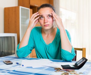 woman annoyed by debt collectors calling
